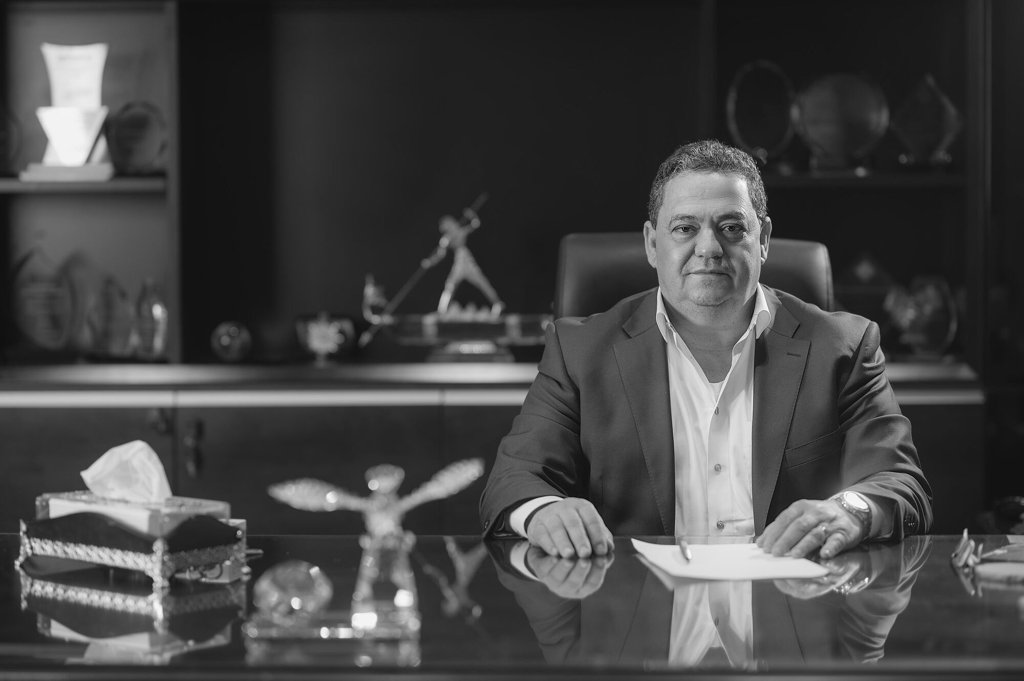 Eng. Amr Shedid, Chairman and CEO, seated at his desk